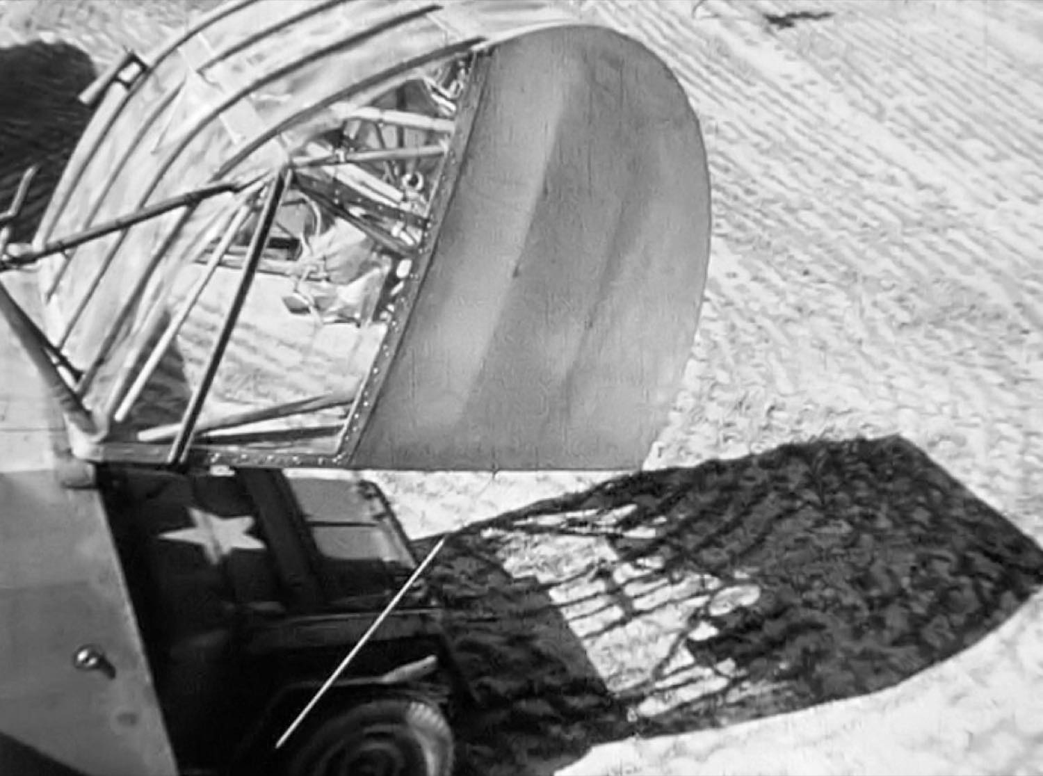 A jeep driven out through the nose of a CG-4