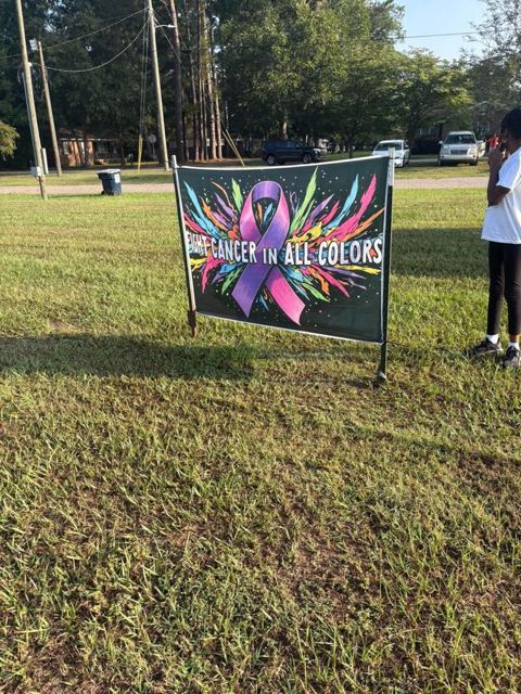 The Cancer in All Colors sign at the walk