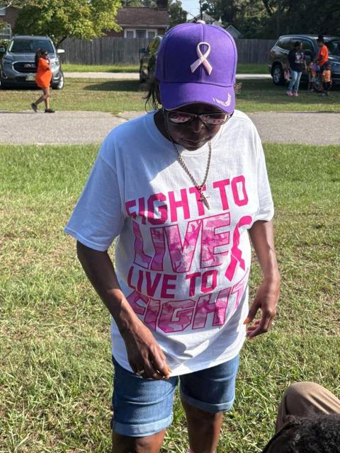 A walker in a Fight to Live shirt