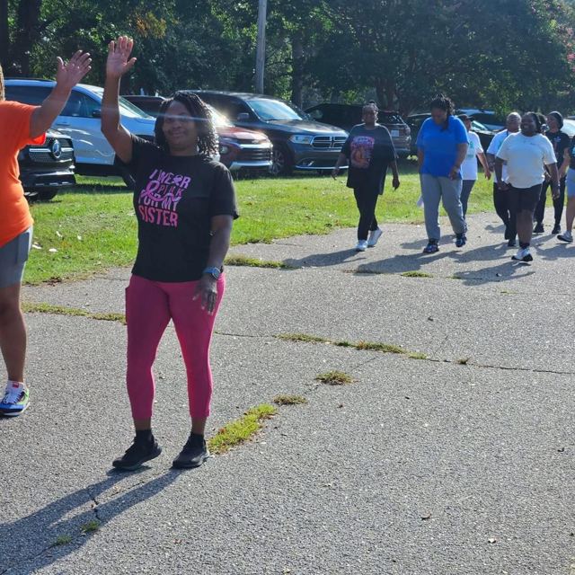 A walker waving